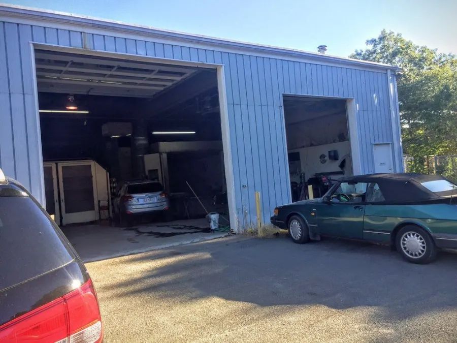 Open bay doors of the collision repair shop